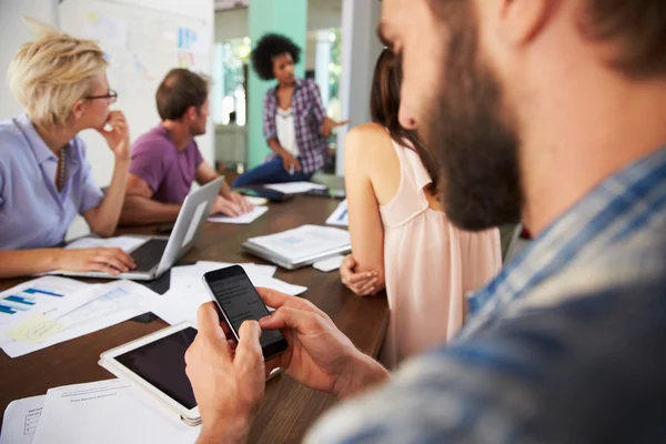 Businessman Texting During Meeting — Stock Photo, Image