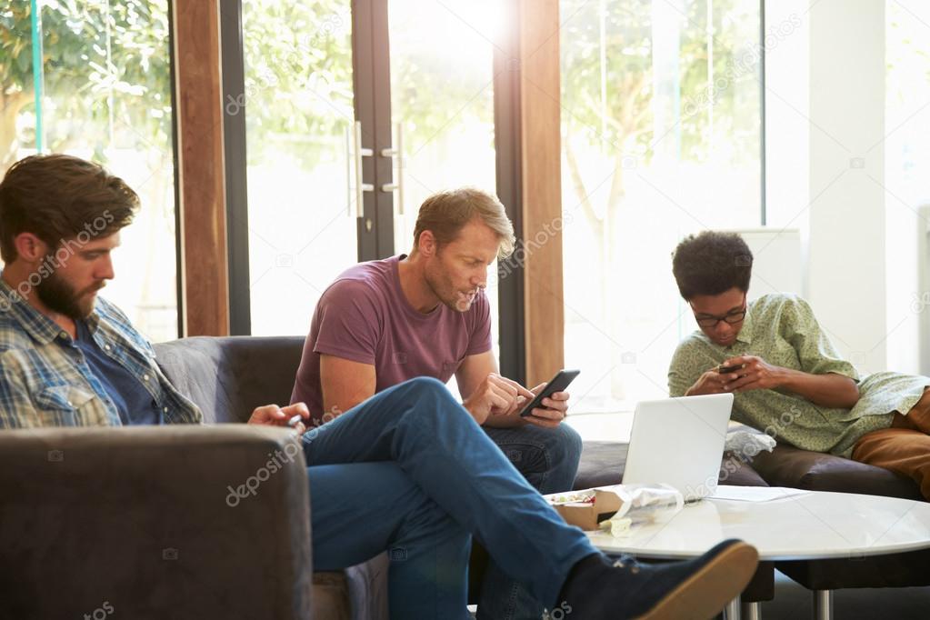 Businessmen Having Working Lunch — Stock Photo © monkeybusiness #106171934