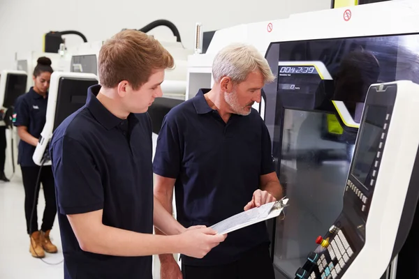 Apprentice Working With Engineer On CNC Machinery — Stock Photo, Image