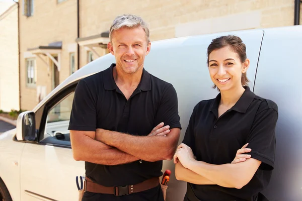 Trade workers standing by a van — Stock Photo, Image