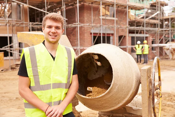 Worker On Building Site Mixing Cement — Stock Photo, Image