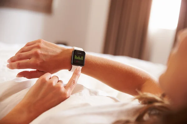 Woman Checking Fitness App on Smart Watch
