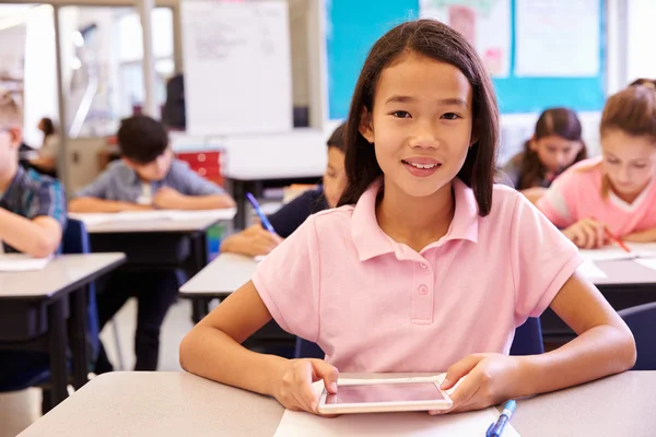 Schoolgirl using tablet computer — Stock Photo, Image