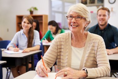 Happy senior woman at an education class clipart