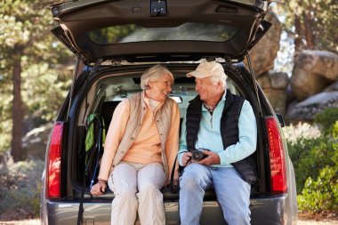 Senior couple before a hike clipart