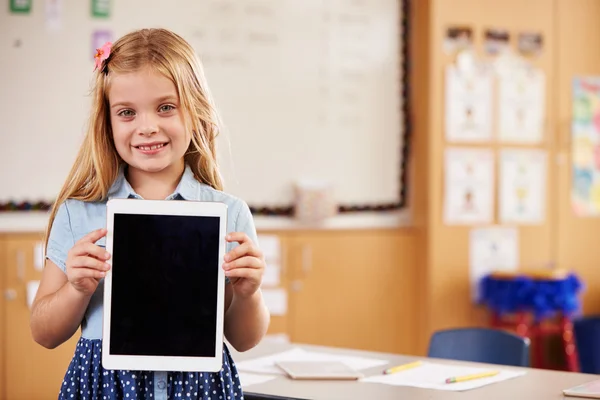 Elementary school girl with a tablet compute — Stock Photo, Image