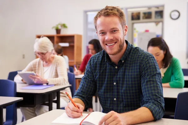 Young man at an adult education class — Stock Photo, Image