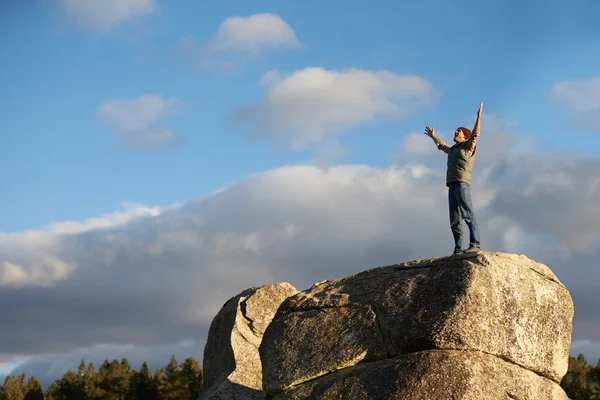 Man standing with arms raised — Stock Photo, Image