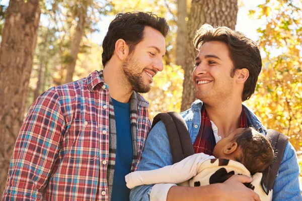 Male Couple With Baby Walking in Woodland — Stock Photo, Image