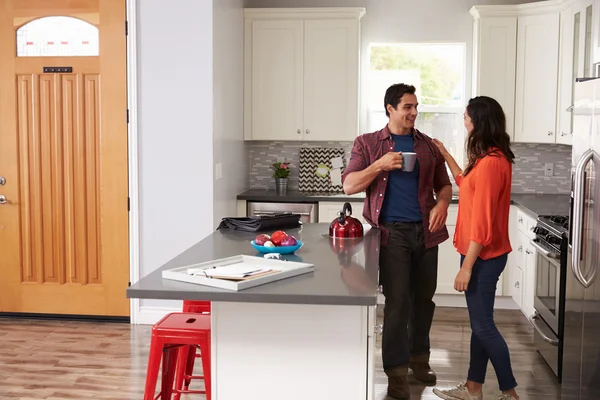 Woman Greeting Man Returning Home