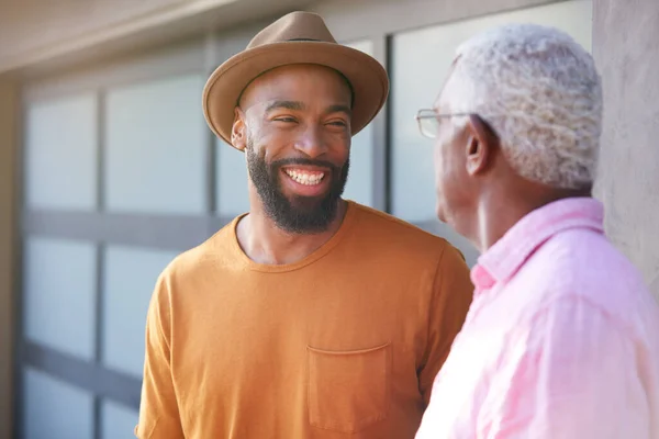 Senior Father Talking Laughing Adult Son Garden Home — Stock Photo, Image