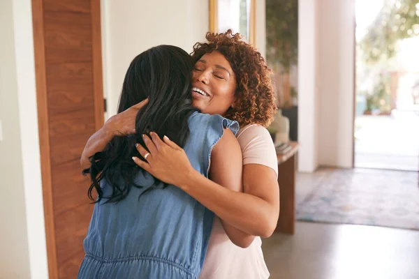 Loving Senior Mother Hugging Adult Daughter Indoors Home — Stock Photo, Image