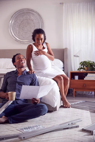 Couple Pregnant Woman Looking Instructions Self Assembly Baby Cot — Stock Photo, Image