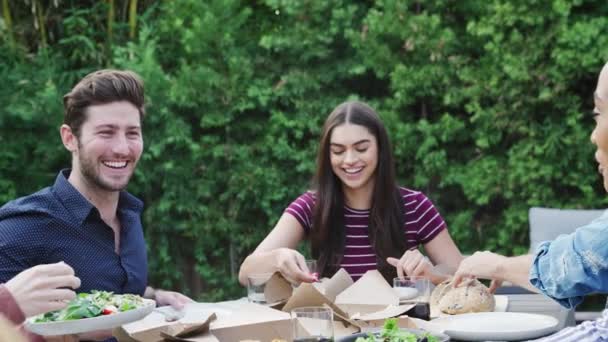 Group Multi Cultural Friends Home Sitting Table Enjoying Food Summer — Stock Video