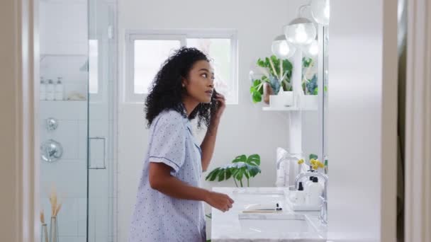 Woman Wearing Pyjamas Standing Front Bathroom Mirror Putting Lip Balm — Stock Video