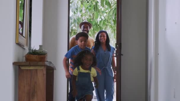 Family Opening Front Door Children Running House Returning Shopping Trip — Stock Video