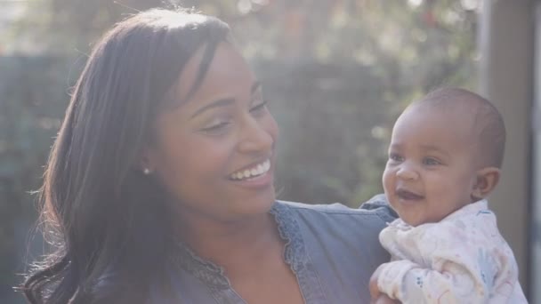 Portrait Smiling Young African American Mother Cuddling Playing Daughter Garden — Stock Video