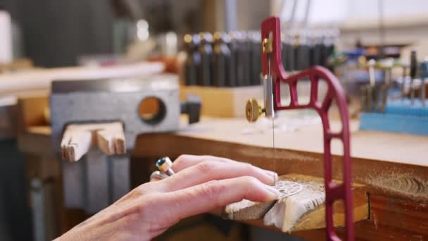 Close Female Jeweller Working Brooch Saw Studio — Stock video