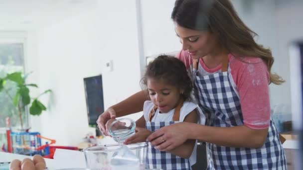 Hispanic Mother Daughter Having Fun Kitchen Baking Cake Together Shot — Stock Video