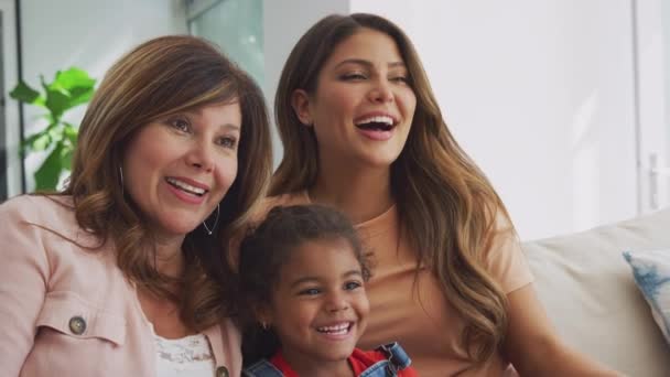 Multi Generation Female Hispanic Family Sofa Home Watching Together Shot — Stock Video