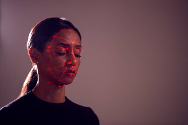 Facial Recognition Technology Concept As Woman Has Red Grid Projected Onto Face In Studio clipart
