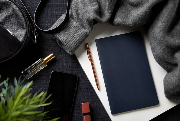Flat Lay Lifestyle Shot Jumper Cosmetics Notebook Handbag Black Background — 스톡 사진
