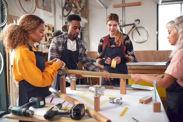 Multi Cultural Team Workshop Assembling Hand Built Sustainable Bamboo Bicycle — Stock Photo, Image