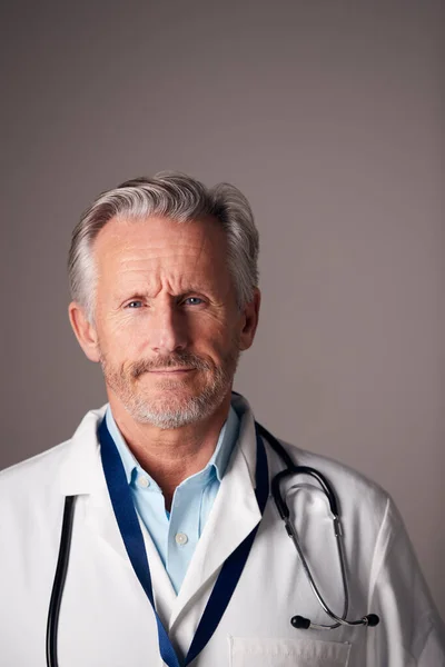 Studio Portrait Mature Male Doctor Wearing White Coat Standing Grey — Stock Photo, Image