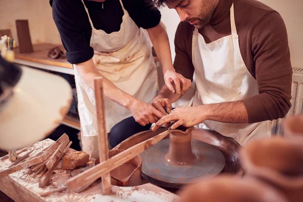 Female Teacher Helping Man Sitting Wheel Pottery Class — Stock Photo, Image