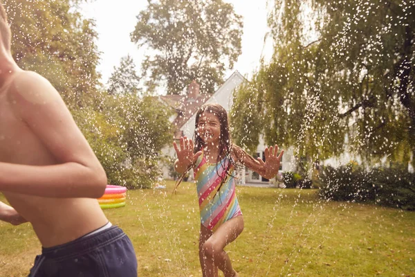 Children Wearing Swimming Costumes Having Fun Garden Playing Water Garden — Stock Photo, Image