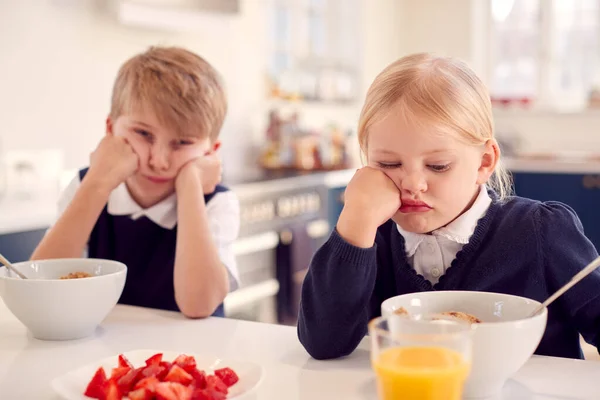Portrait Two Fed Children Wearing School Uniform Kitchen Eating Breakfast — Stock Photo, Image