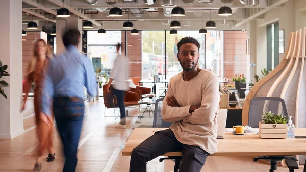 Portrait Businessman Sitting Desk Busy Multi Cultural Office Motion Blurred — 스톡 사진