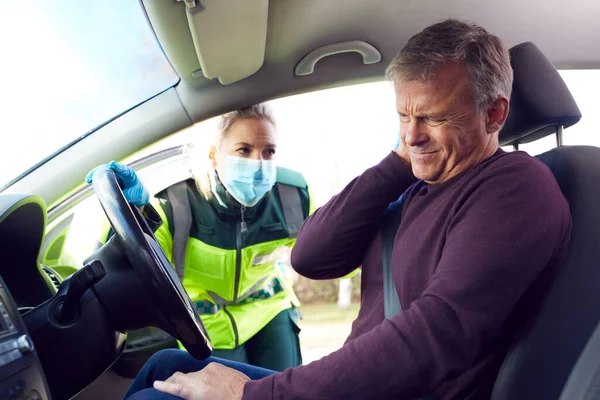 Female Paramedic Helping Mature Male Driver Whiplash Injury Involved Road — Stock Photo, Image