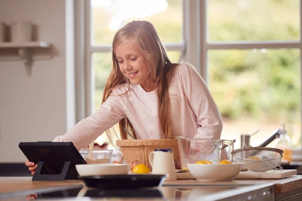 Girl Wearing Pyjamas Making Pancakes Kitchen Home Recipe Digital Tablet — Stock Photo, Image