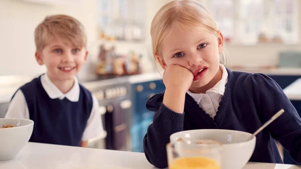 Portrait Two Fed Children Wearing School Uniform Kitchen Eating Breakfast — Stockfoto