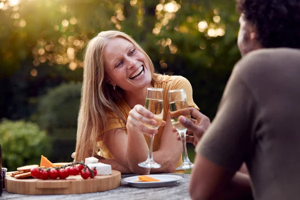 Mature Couple Celebrating Champagne Sit Table Garden Snacks — Stock Photo, Image