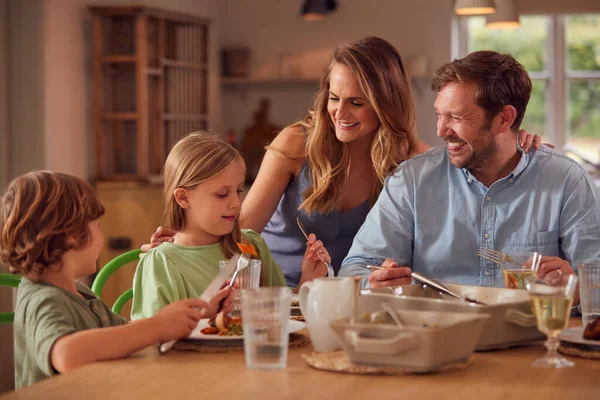 Family Sitting Table Home Enjoying Meal Together — Stock Photo, Image