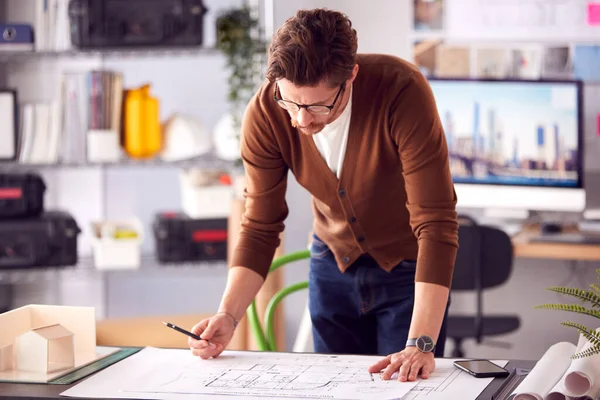 Male Architect Standing Desk Office Amending Building Plans — Stock fotografie