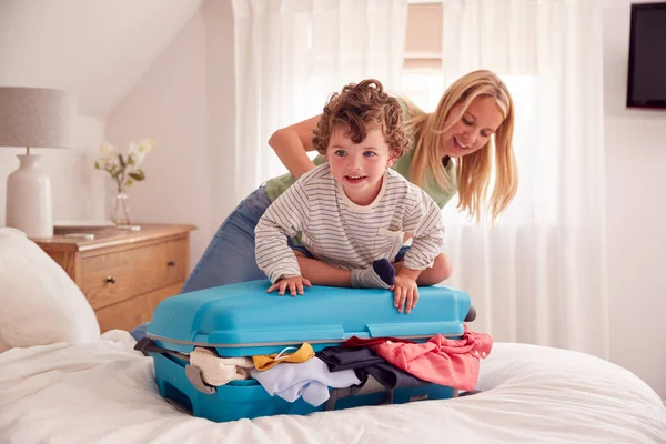 Mother Son Packing Vacation Boy Standing Full Suitcase Close — Stock Photo, Image