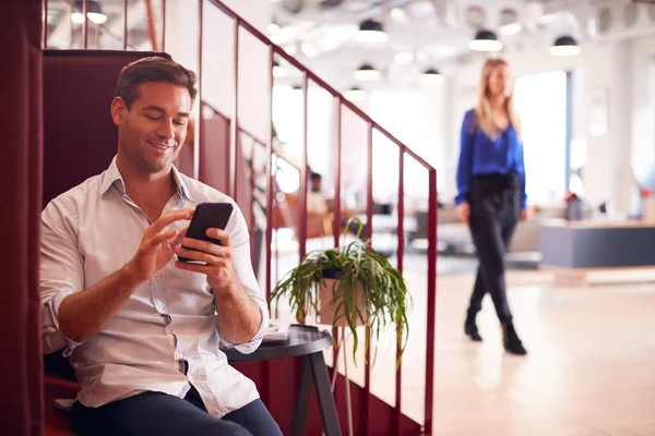 Businessman Sitting Stairs Modern Open Plan Office Checking Messages Mobile — Stock Photo, Image