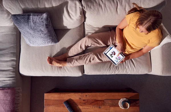 Overhead Shot Woman Relaxing Sofa Browsing Streaming Movie Digital Tablet — Φωτογραφία Αρχείου