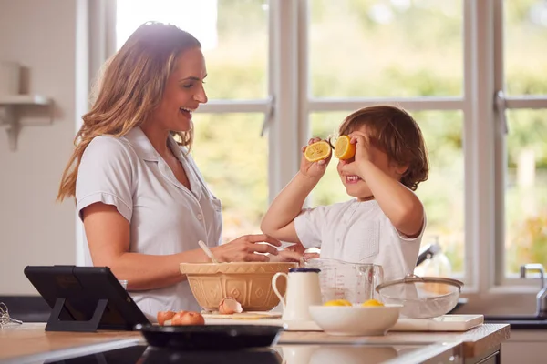 Mother Son Pyjamas Making Pancakes Kitchen Home Recipe Digital Tablet — Stock Photo, Image