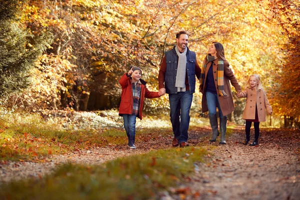 Family Mature Parents Two Children Holding Hands Walking Track Autumn — Stock Photo, Image