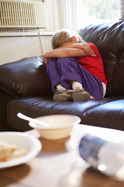 Unhappy Girl Sitting On Sofa — Stock Photo, Image