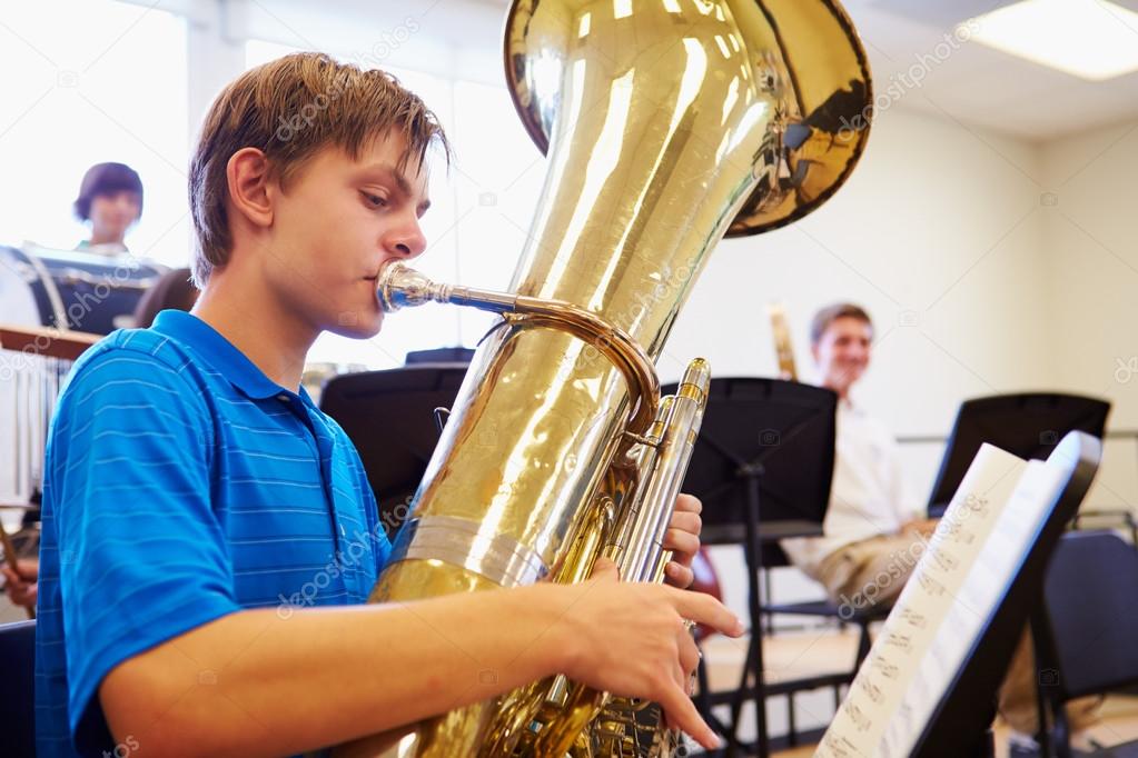 Resultado de imagem para menino tocando tuba