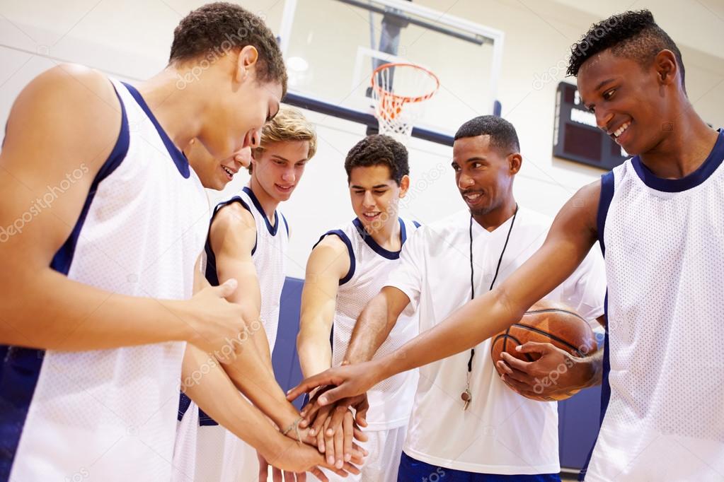 Basketball Team Having Talk With Coach Stock Photo by ©monkeybusiness