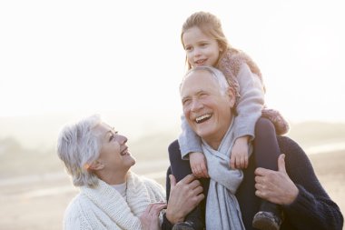 Grandparents And Granddaughter Walking clipart