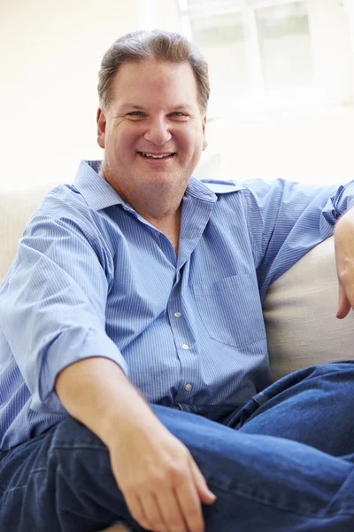 Overweight Man Sitting On Sofa — Stock Photo, Image