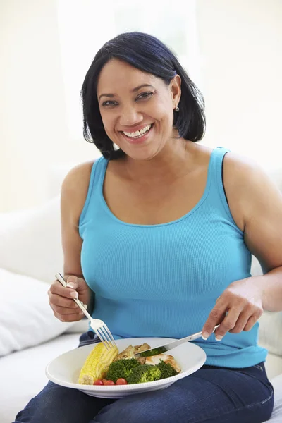 Overweight Woman Eating Healthy Meal Stock Image