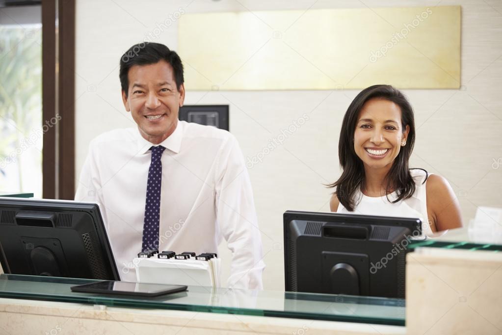 Reception Staff At Hotel Stock Photo by ©monkeybusiness 59873343